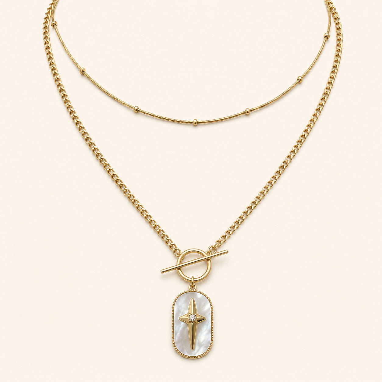 Nouriya, collier double rang doré à pendentif nacré étoilé sur fond ivoire – OZ’anges