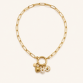 Talyana, collier doré multicharmes sur fond ivoire – OZ’anges